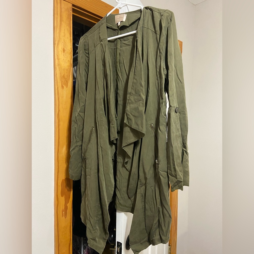 Green jacket with metal zipper & button to roll up sleeves. Worn a couple times